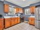 Bright kitchen with stainless steel appliances, ample cabinet space, and easy-to-clean tile flooring at 1816 N Moreland Ave, Indianapolis, IN 46222