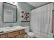 Stylish bathroom featuring blue walls, a patterned shower curtain, and modern fixtures at 2018 Cornell Ave, Indianapolis, IN 46202