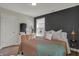 Bedroom featuring a board and batten accent wall, neutral decor, and a plush rug at 2018 Cornell Ave, Indianapolis, IN 46202