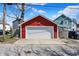 Detached two-car garage offering ample space for parking and storage; surrounded by lush greenery at 2018 Cornell Ave, Indianapolis, IN 46202