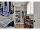 Organized walk-in closet with shelving, hanging racks, and shoe storage for optimal wardrobe display and storage at 2018 Cornell Ave, Indianapolis, IN 46202