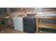 Basement laundry area with new washer, dryer, and ample space for storage at 213 S Brittain Ave, Muncie, IN 47303