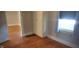 This bedroom showcases hardwood floors, natural light, and a built-in closet at 213 S Brittain Ave, Muncie, IN 47303