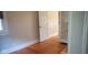 Hardwood floors, white trim, and a bright window make this bedroom a cozy retreat at 213 S Brittain Ave, Muncie, IN 47303