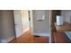 Hardwood floors and neutral paint create a warm and inviting atmosphere in this bedroom at 213 S Brittain Ave, Muncie, IN 47303