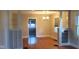 Bright living room with refinished floors and traditional moldings at 213 S Brittain Ave, Muncie, IN 47303