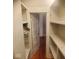 Spacious walk-in closet boasts custom shelving on both sides for optimal organization at 213 S Brittain Ave, Muncie, IN 47303