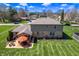 Aerial view of a backyard with a brick house and patio furniture at 2328 Discovery Dr, Anderson, IN 46017