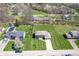 Aerial view of the home, showcasing the backyard and tree lined street at 2328 Discovery Dr, Anderson, IN 46017