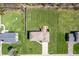 A top-down aerial view, highlighting the home's manicured lawn at 2328 Discovery Dr, Anderson, IN 46017