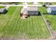 An aerial view of the house showcasing the well-manicured lawn and surrounding neighborhood at 2328 Discovery Dr, Anderson, IN 46017