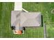 Aerial shot of the home's roof and back patio, highlighting lawn at 2328 Discovery Dr, Anderson, IN 46017