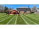 Landscaped backyard showcasing a patio area perfect for outdoor entertaining at 2328 Discovery Dr, Anderson, IN 46017