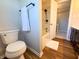 Bathroom featuring a toilet, shower with door leading out and a vanity with a framed mirror at 2328 Discovery Dr, Anderson, IN 46017