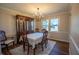 Comfortable dining room featuring large window and classic chandelier at 2328 Discovery Dr, Anderson, IN 46017