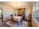Traditional dining room with a chandelier, a wooden dining set, and a large china cabinet at 2328 Discovery Dr, Anderson, IN 46017