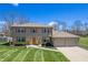 Beautiful home with brick accents, manicured lawn and two car garage at 2328 Discovery Dr, Anderson, IN 46017