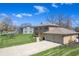 Beautiful two-story home with brick accents and a long driveway leading to an attached two-car garage at 2328 Discovery Dr, Anderson, IN 46017