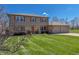 Charming two-story home with well-maintained lawn and brick two-car garage at 2328 Discovery Dr, Anderson, IN 46017