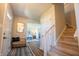 Inviting foyer with stylish mirror, staircase, and open doorway at 2328 Discovery Dr, Anderson, IN 46017