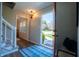 Inviting foyer with hardwood floors, staircase, and stylish light fixture at 2328 Discovery Dr, Anderson, IN 46017