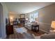 Cozy living room featuring a brick fireplace, plush seating, and stylish wood flooring at 2328 Discovery Dr, Anderson, IN 46017