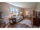 Comfortable living room with a plush sofa, stylish end tables, and wood floors at 2328 Discovery Dr, Anderson, IN 46017