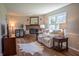 Inviting living room featuring a cozy fireplace and comfortable seating arrangement at 2328 Discovery Dr, Anderson, IN 46017