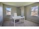 Bright home office featuring two windows, neutral carpet, and modern desk at 2328 Discovery Dr, Anderson, IN 46017