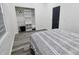 Bright bedroom with new flooring and a built in closet at 249 E Minnesota St, Indianapolis, IN 46225