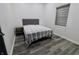 Neutral bedroom with a modern-style bed and gray accents throughout at 249 E Minnesota St, Indianapolis, IN 46225