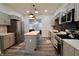 Modern kitchen features stainless steel appliances, grey cabinets, and center island at 249 E Minnesota St, Indianapolis, IN 46225