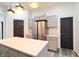 This modern kitchen features an island, stainless steel appliances, and gray cabinetry at 249 E Minnesota St, Indianapolis, IN 46225