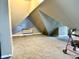An attic space, with off-white walls and grey carpets at 26 N Holmes Ave, Indianapolis, IN 46222