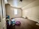 Bedroom with a window, brown carpet and off-white walls at 26 N Holmes Ave, Indianapolis, IN 46222