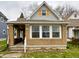 Charming single-Gathering home featuring a brick facade and yellow-shuttered dormer window at 26 N Holmes Ave, Indianapolis, IN 46222