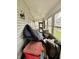 Enclosed porch with windows, offering natural light and additional space at 26 N Holmes Ave, Indianapolis, IN 46222