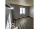 Comfortable bedroom featuring neutral walls, natural light, and modern flooring at 2706 Country Estates Dr, Indianapolis, IN 46227