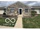 Charming single-story home with stone facade and well-maintained lawn at 2706 Country Estates Dr, Indianapolis, IN 46227