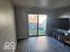 Bright living room with sliding glass doors leading to the outdoor space at 2706 Country Estates Dr, Indianapolis, IN 46227