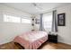 Inviting bedroom featuring hardwood floors, natural light, and simple decor at 2816 Canterbury Ln, Indianapolis, IN 46220