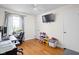 Functional home office space with desk, chair, and natural light from the window at 2816 Canterbury Ln, Indianapolis, IN 46220