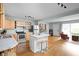 Open kitchen features stainless steel appliances, marble countertops, and a center island with stool seating at 2816 Canterbury Ln, Indianapolis, IN 46220
