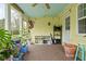 Charming sunroom featuring brick floors, plants, and views of the outdoor space at 2816 Canterbury Ln, Indianapolis, IN 46220