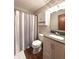Bathroom with a shower and tub combination and updated vanity provides comfort and practicality at 300 Kathryn Ct, Clayton, IN 46118