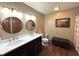 Elegant bathroom features a double vanity, with marble countertops and modern fixtures, perfect for a spa-like experience at 300 Kathryn Ct, Clayton, IN 46118