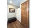 Clean and functional bathroom featuring a shower with patterned curtain and a storage bench for convenience at 300 Kathryn Ct, Clayton, IN 46118