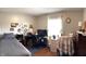 Bright bedroom with natural light, a bed, a desk, and decorations creates a comfortable working space at 300 Kathryn Ct, Clayton, IN 46118