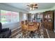 Charming dining room has a wooden table and chairs, bathed in natural light and perfect for dinner parties at 300 Kathryn Ct, Clayton, IN 46118