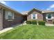 Inviting brick home with a well-maintained lawn, green shrubbery, and a welcoming front entrance with a small porch at 300 Kathryn Ct, Clayton, IN 46118